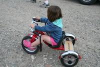 05232009JoleighOnTricycleAudreyOutside