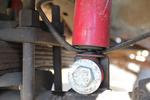 Brake hose pinched into the shock