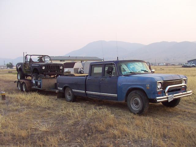 Racer and 4dr, parked behind the house, near the west edge of the property, by the well (handy for using the pressure washer)