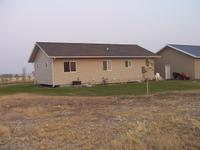 View from in front of the truck, looking east/south-east at the house/garage