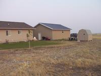 Looking south/south-east, you see the house, garage, riding tractor, shed, with Oscar's hardtop and Tigger viewable.