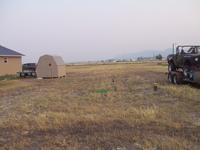 Width between shed/garage and where the well is, and the trailer gettin' close to the property line.