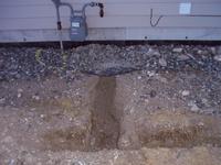 Elbow of the trench, to the gas meter