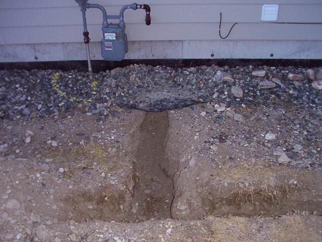 Elbow of the trench, to the gas meter
