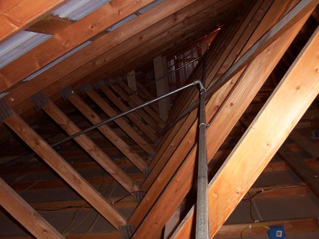 Standing at the south end, looking north, on the west side.  You see the air line sloping up to the north end (supply end, where