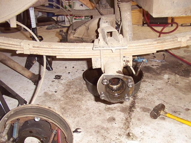 Disassembling - axle and drum removed - you can see my bump stop extension mounted to the U-bolt plate.  It needs replaced, sinc