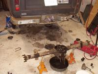 Rear diff draining, waiting for the bearing caps to come off and the carrier to come out.