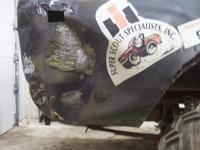 Grinding paint on the big dents prior to welding machine screws to it for pulling