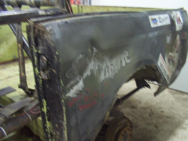 Grinding paint on the big dents prior to welding machine screws to it for pulling