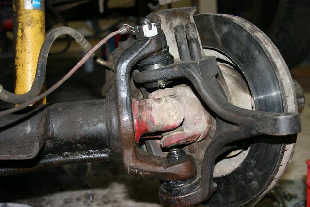 Driver's side flat-top with new revision Moog balljoints you can grease without pulling the axle.