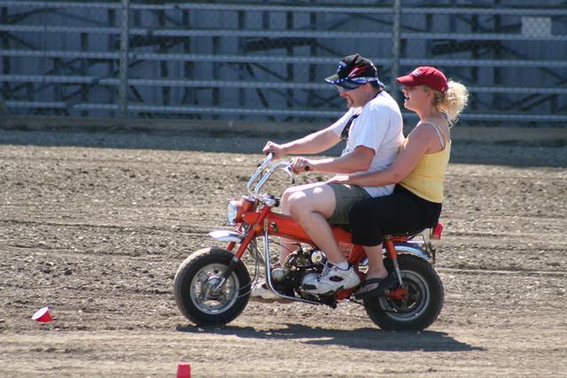 John Fleck and Lau-ren do the divorce course on his motorcycle.