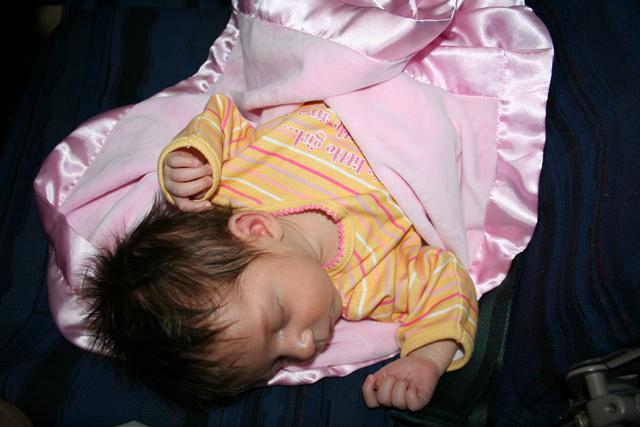 Joleigh asleep on her first plane ride