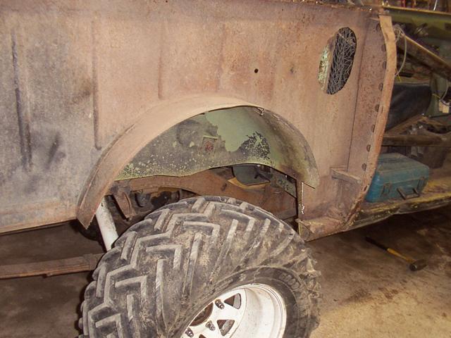'nother view, showing the splash guard at the front of the wheel well has been removed.