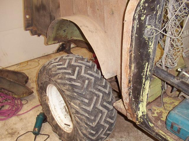 'nother view, showing the splash guard at the front of the wheel well has been removed.