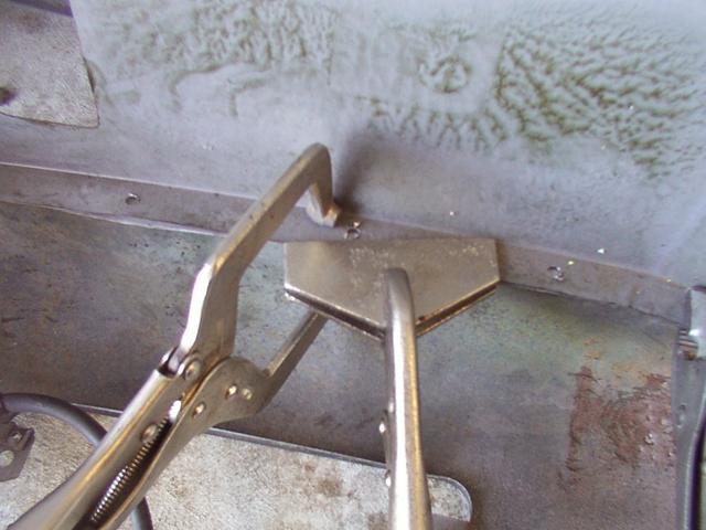 This is the trick I found worked best, using the long flat vice-grips diagonally to pinch the metal together, and the other to m