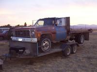 79 1T flatbed dually on my 16' trailer behind my '74 1T SRW long-box crewcab IH.