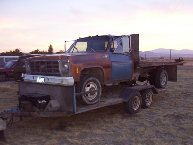 79 1T flatbed dually on my 16' trailer behind my '74 1T SRW long-box crewcab IH.