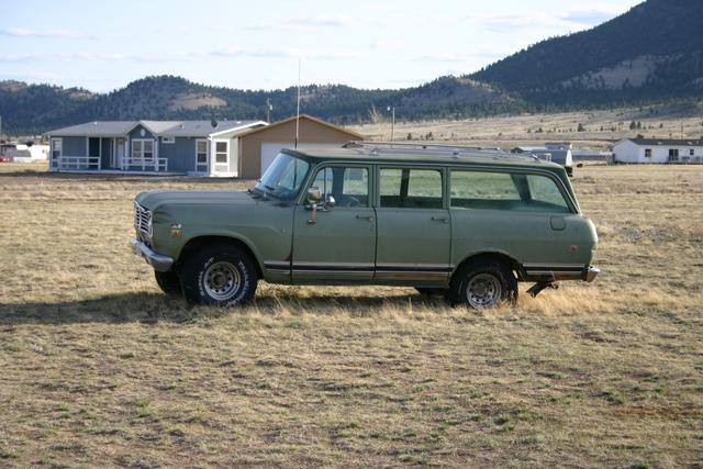 BUGM sits in the field - motionless for a year with a suspected bad rear end, and now a flat driver's rear tire.