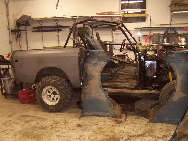 Passenger side done, both fenders trimmed and a few spots painted.