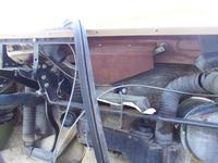 Behind this panel is where the windshield wiper motor is located in this 70s Travelall