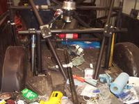 Wide angle view with U-bolts holding the upright to the rear kickers of the cage