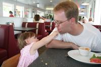 Lunch at the Moab Diner - Joleigh feeds Dad some of her left over grilled cheese