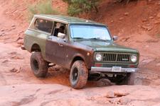 Stuck near the end of Bull Canyon, below Gemini Bridges - passenger rear tire is in the air, driver's is digging into the sand.