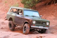 Stuck near the end of Bull Canyon, below Gemini Bridges - passenger rear tire is in the air, driver's is digging into the sand.