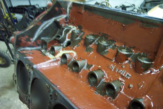 Lifters removed - notice the Gyptal (red paint) failing