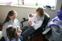 IMG_7134 - Cousin Carrie holding Audrey, Grandmom and Joleigh watch