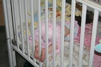 03292010 Joleigh and Audrey sleeping - sideways - in their beds