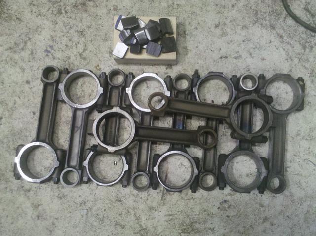 8 lightened con rods, the pieces removed, and two originals